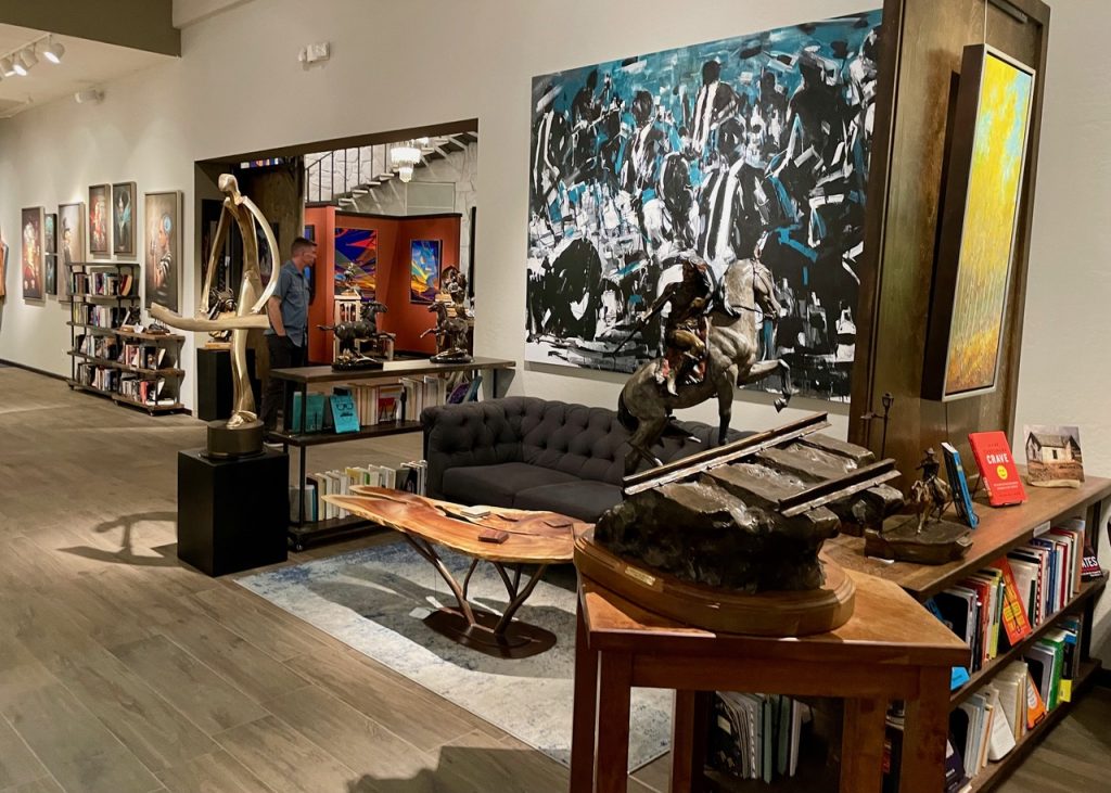 Anticus Gallery in Old Town, with paintings, sculptures, and books