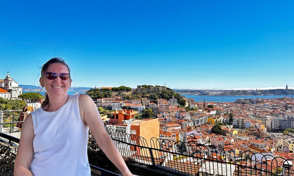 Author enjoying the view of Lisbon on a solo tour.